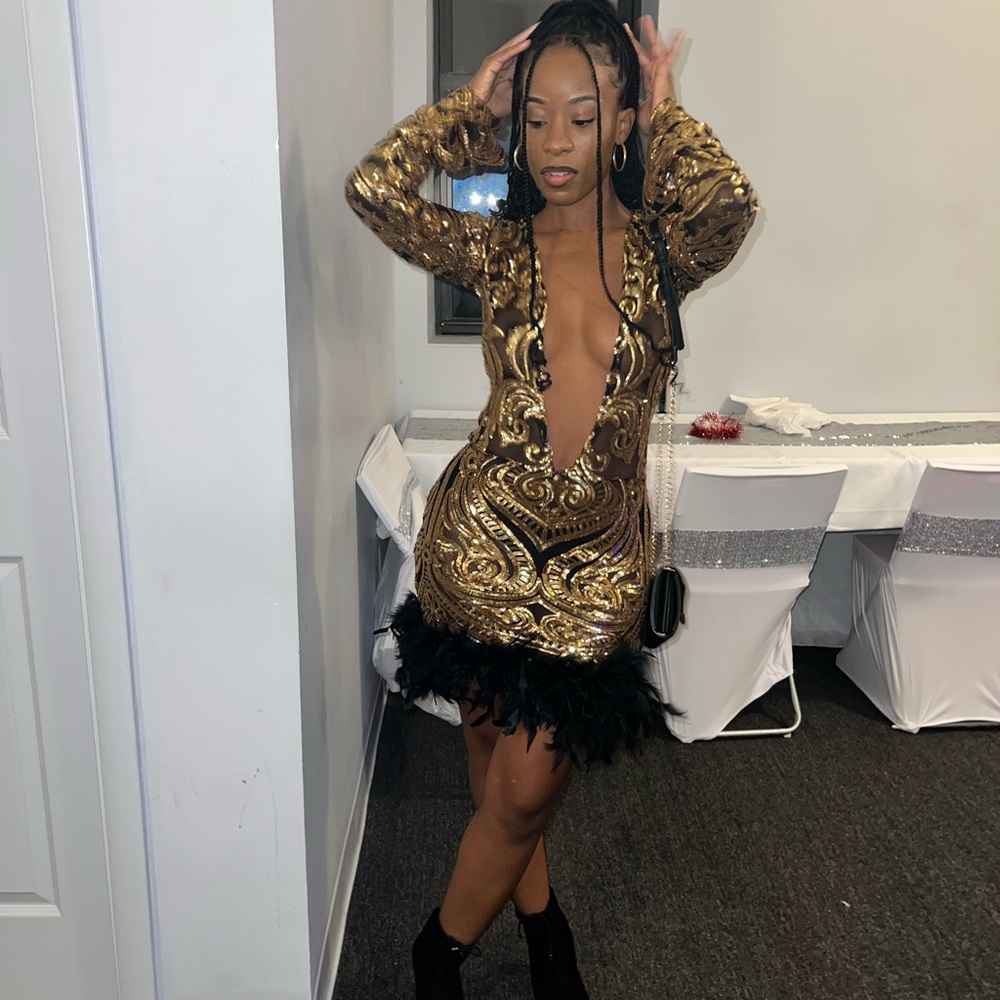 Black and gold sequin dress